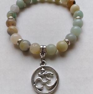 Beaded stretch bracelet with Buddha charm dangle